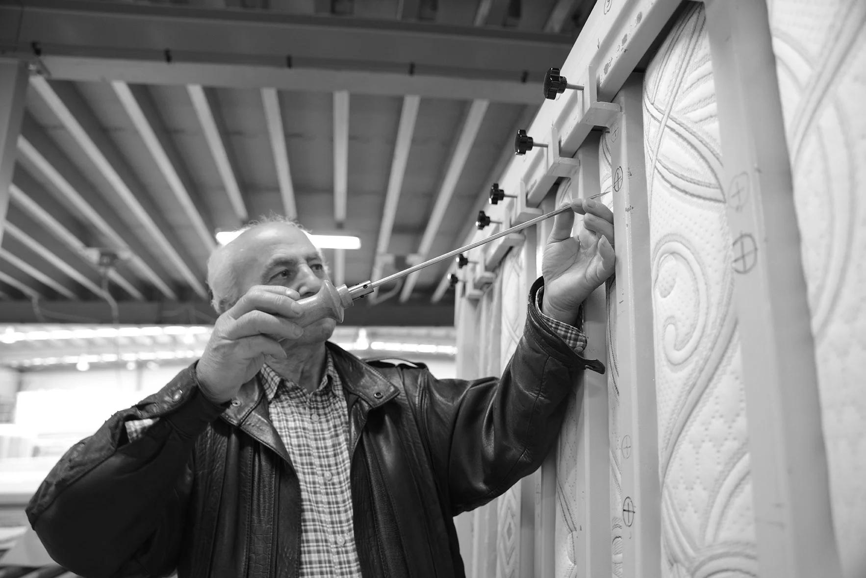 Team member inspecting mattress fabric in the Slumbercare factory